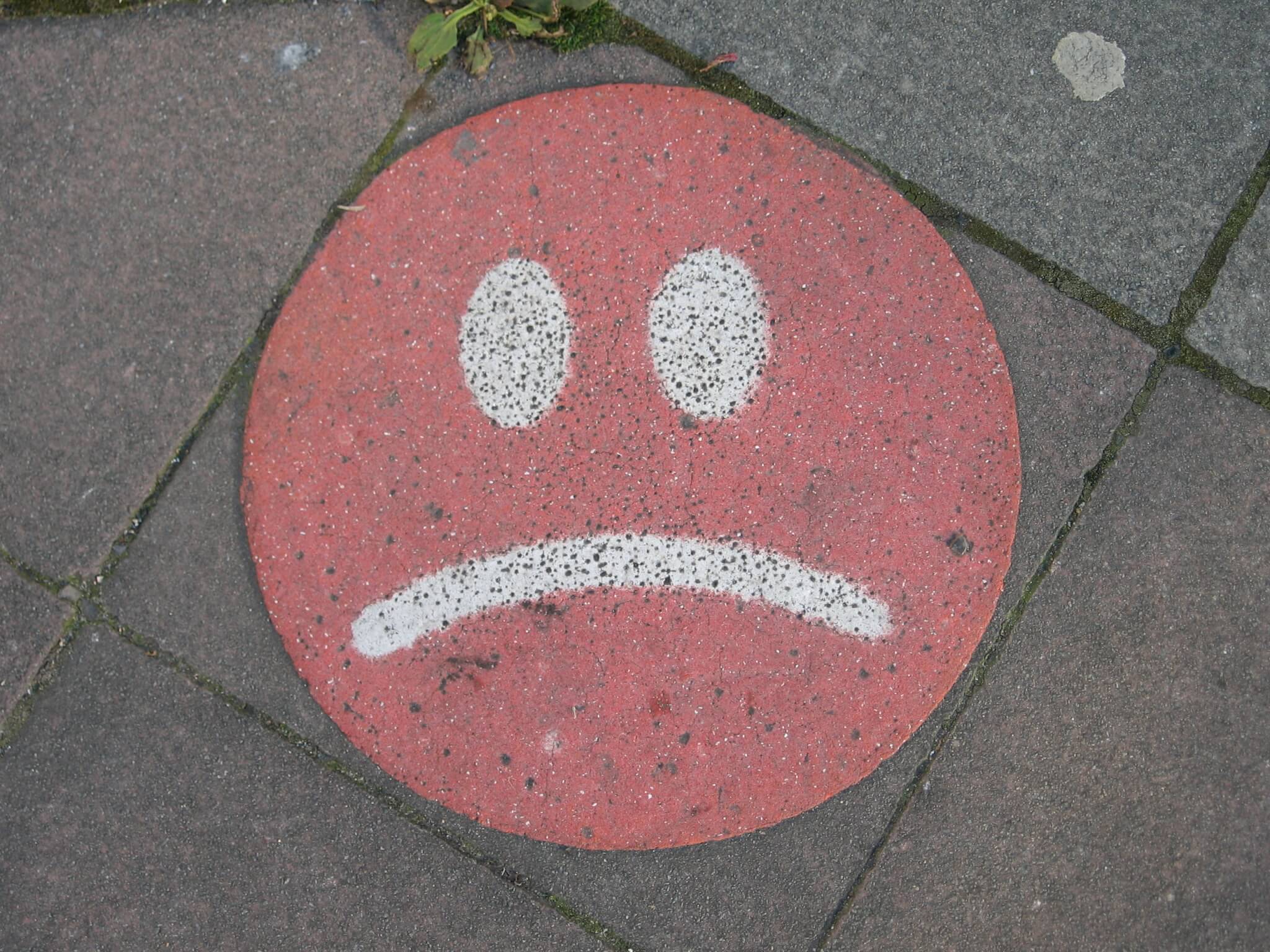 sad face on concrete